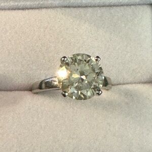 SOLD Sold  6CARAT beautiful moissanite set in a four prong platinum setting